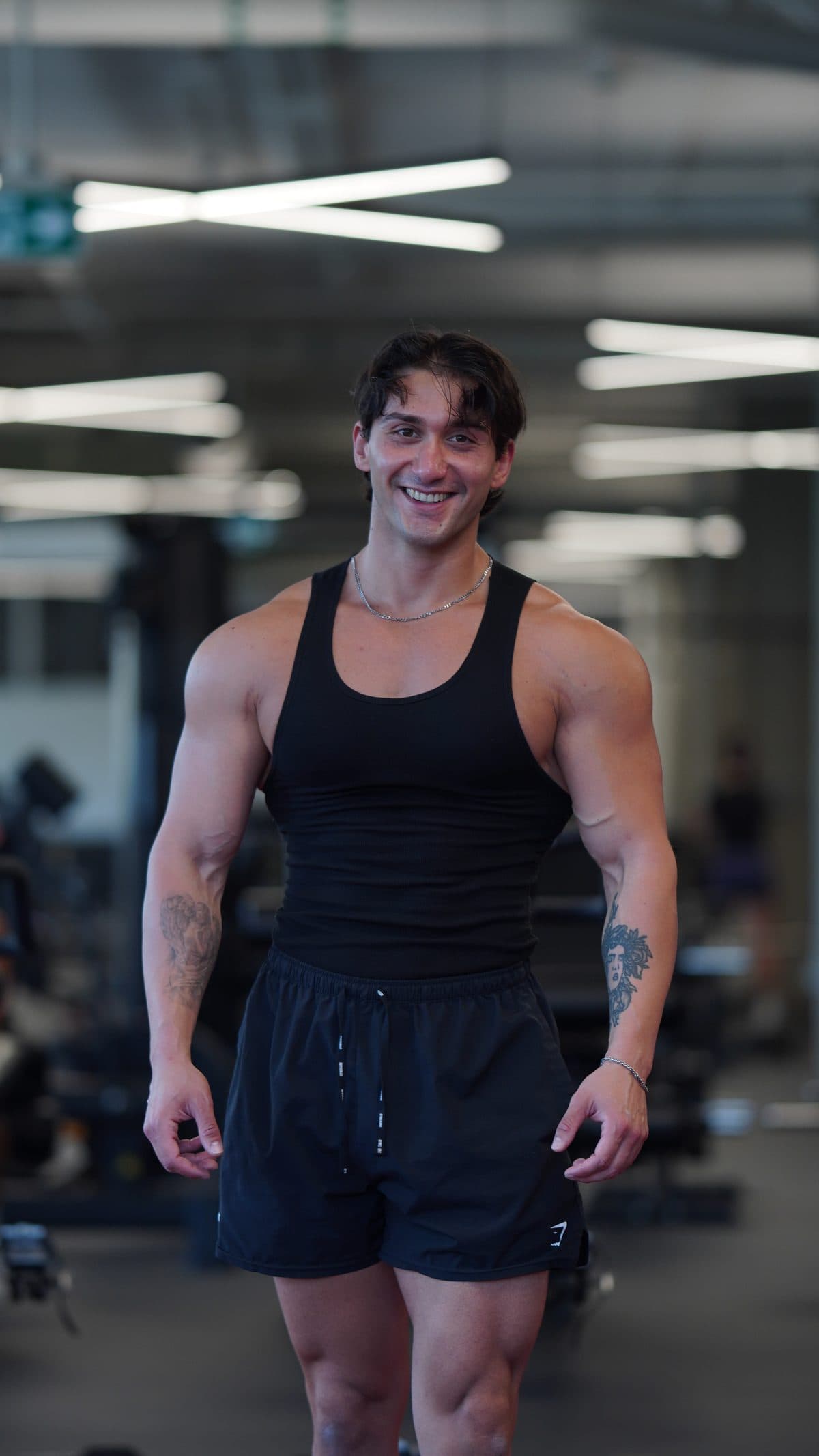 Celal Koca smiling on the gym floor